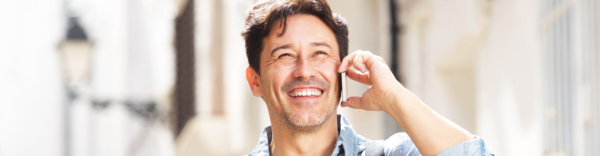 man smiling on phone