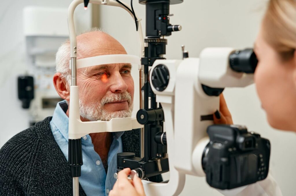 A mature man receiving an eye exam.