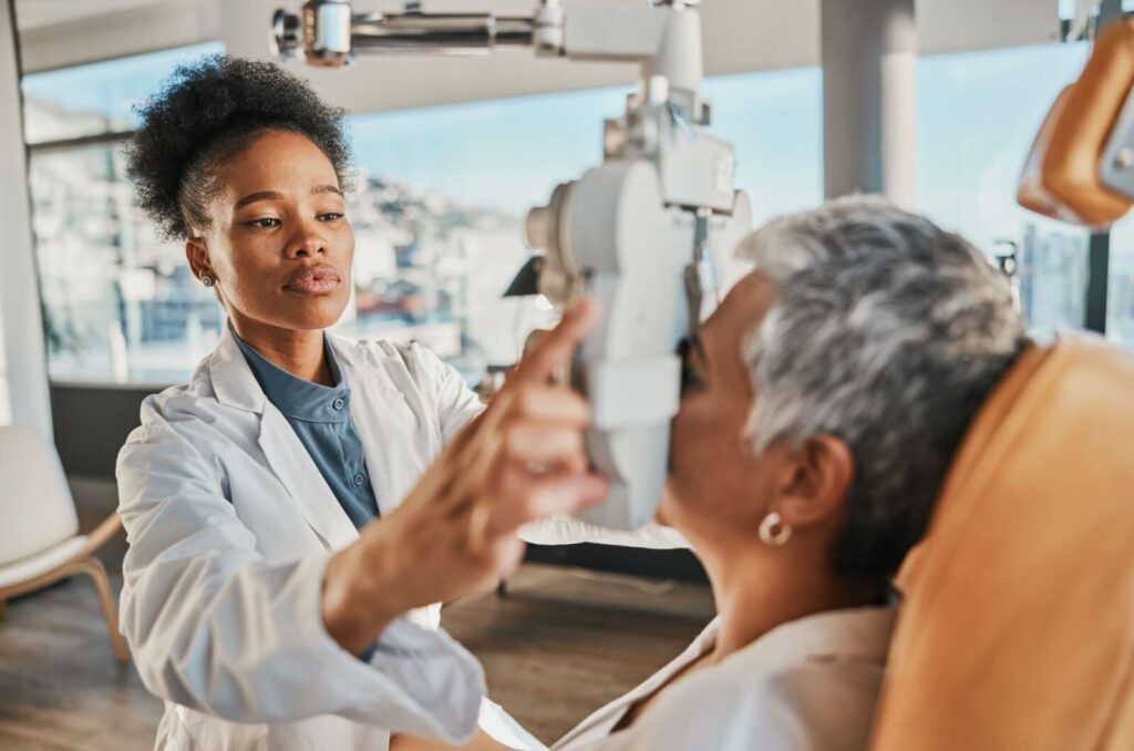 an optometrist checks a patient's sight to diagnose and treat refractive errors