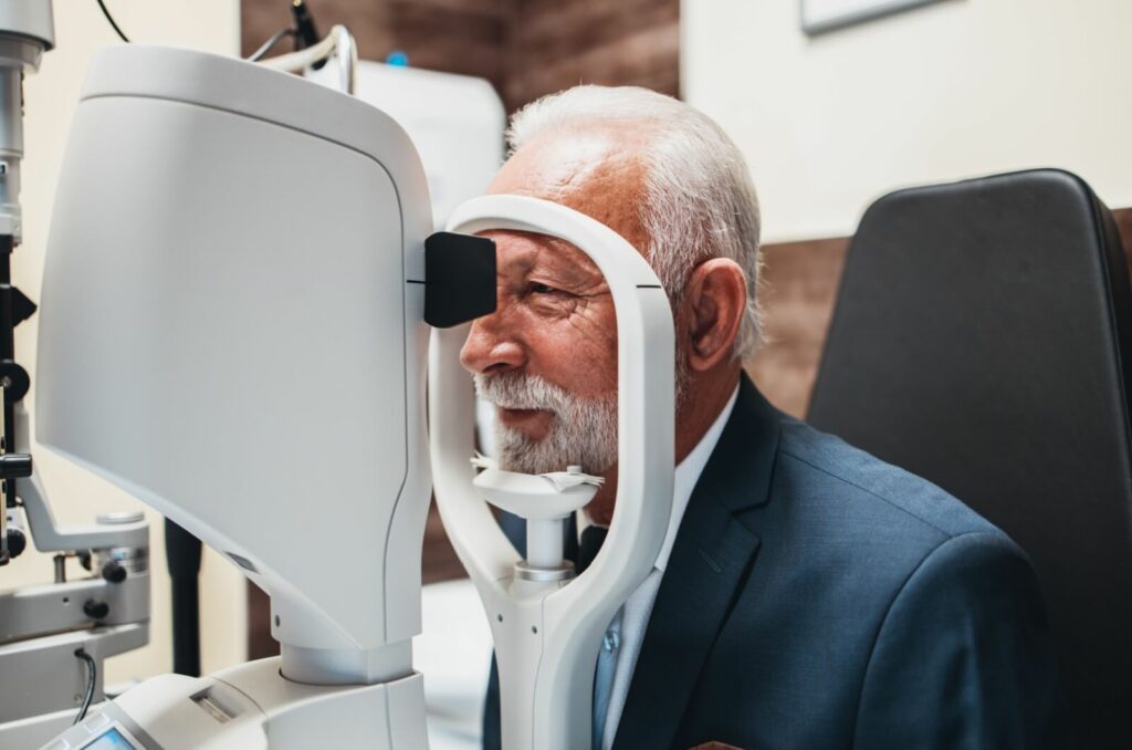 an older patient receives their routine eye exam to check for signs of glaucoma