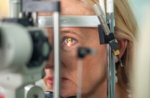 A close-up image of an older patient during an eye exam to test for signs of glaucoma.